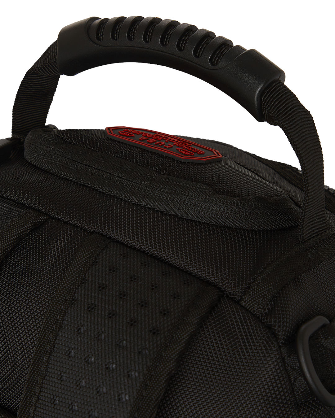 Close-up of faux leather exterior with gold zippers on the backpack
