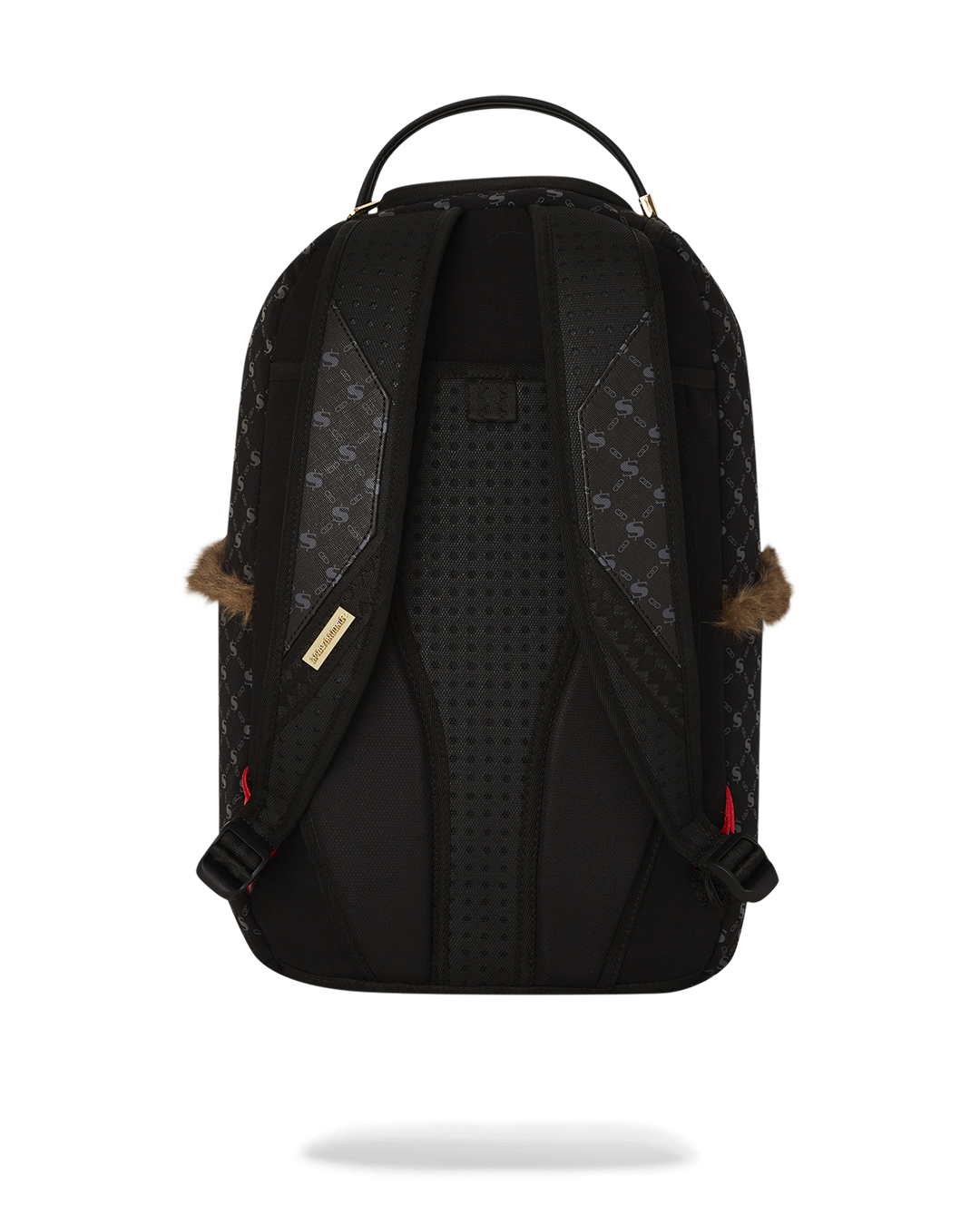 Side view of the faux leather backpack showing gold zippers and stash pocket