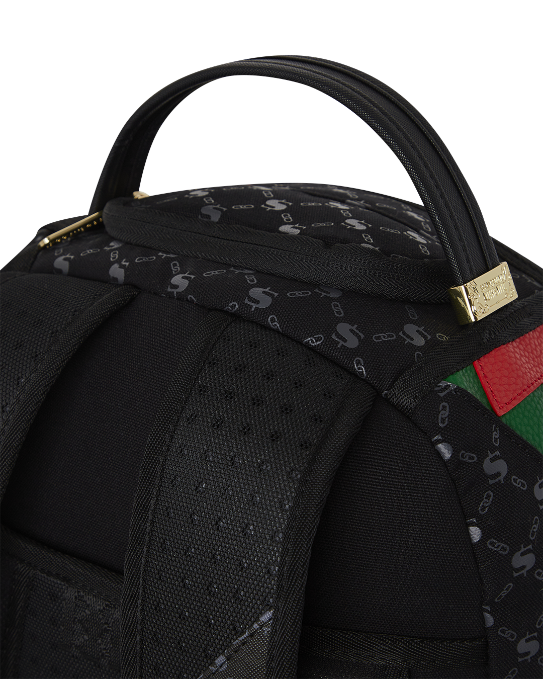 Side view of the faux leather backpack showing gold zippers and stash pocket