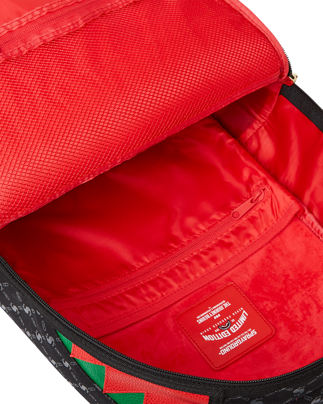 Peak design travel backpack attached to carry-on luggage at airport terminal