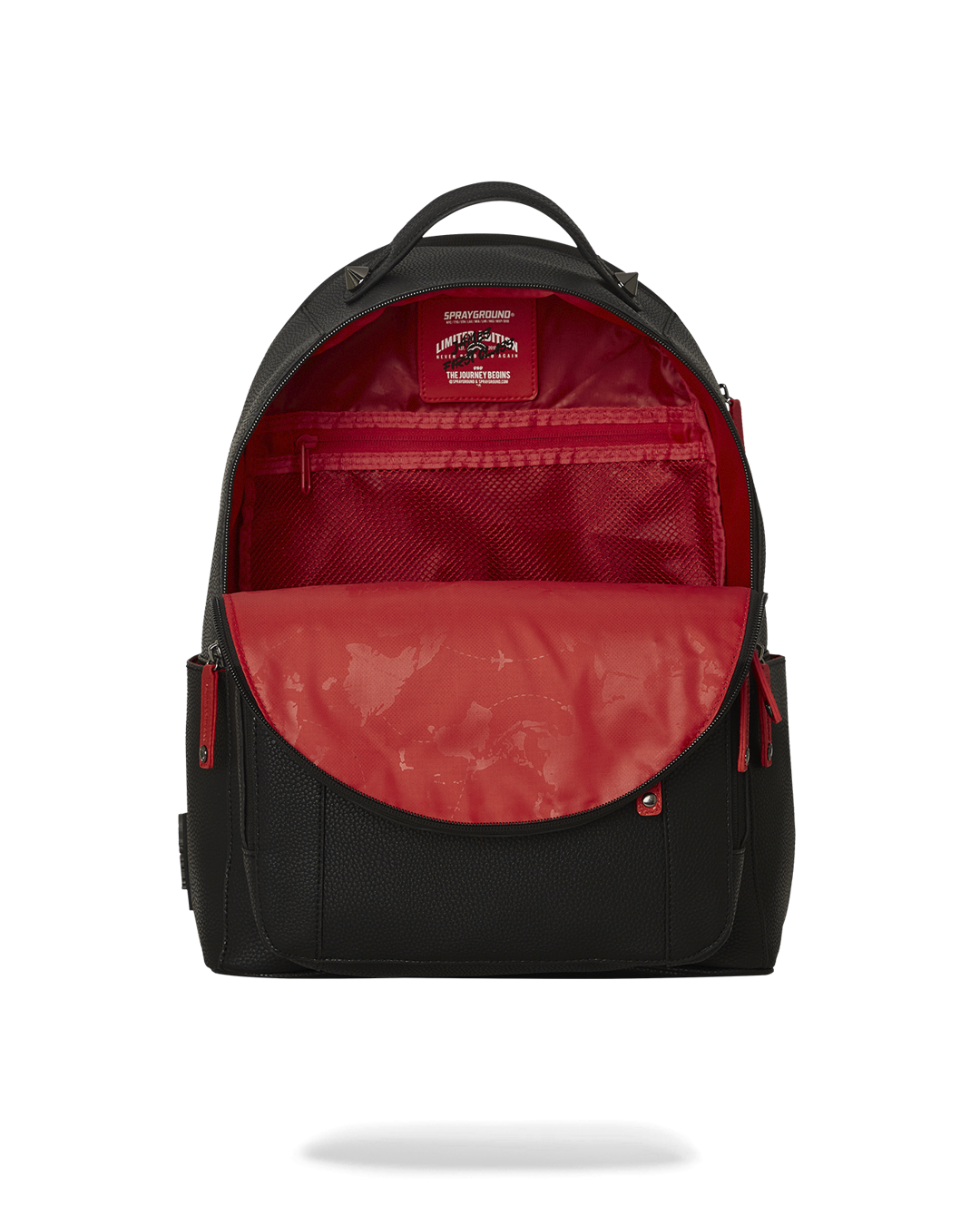 Backpack opened to reveal interior compartments for travel essentials