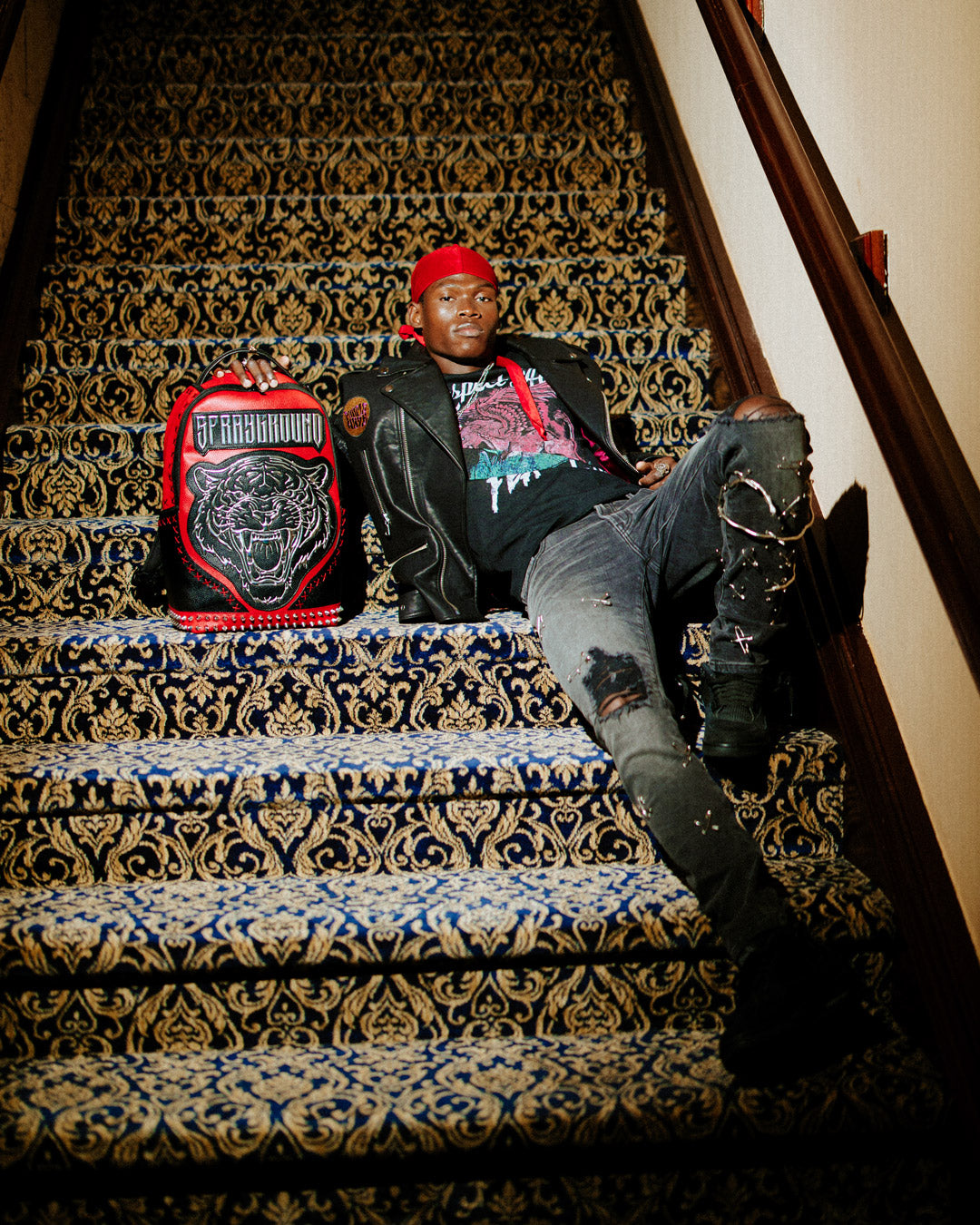 Urban Explorer backpack showcasing faux leather texture and metallic details.