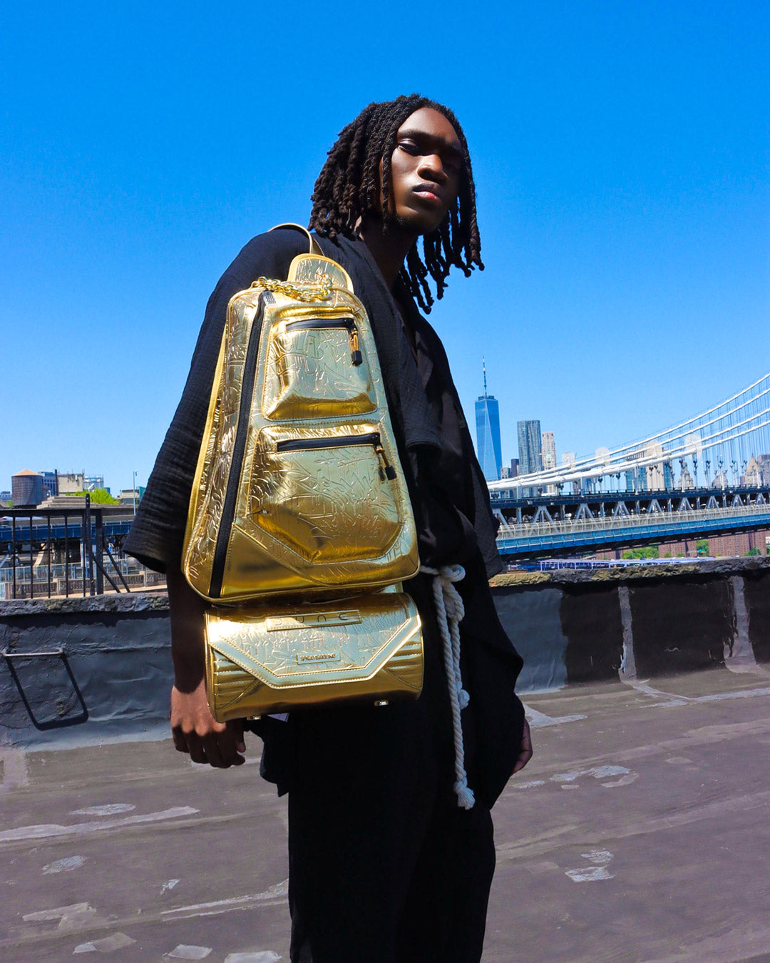 Versatile Dune crossbody bag displayed in an urban setting.
