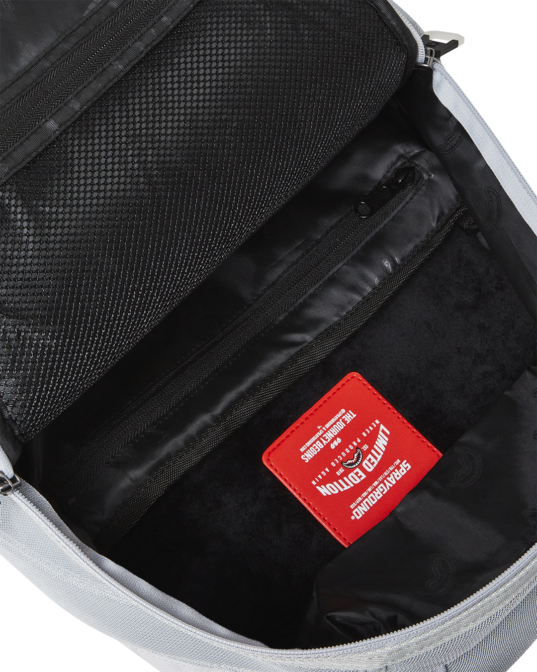 Interior view of the laptop compartment and mesh organizer pockets
