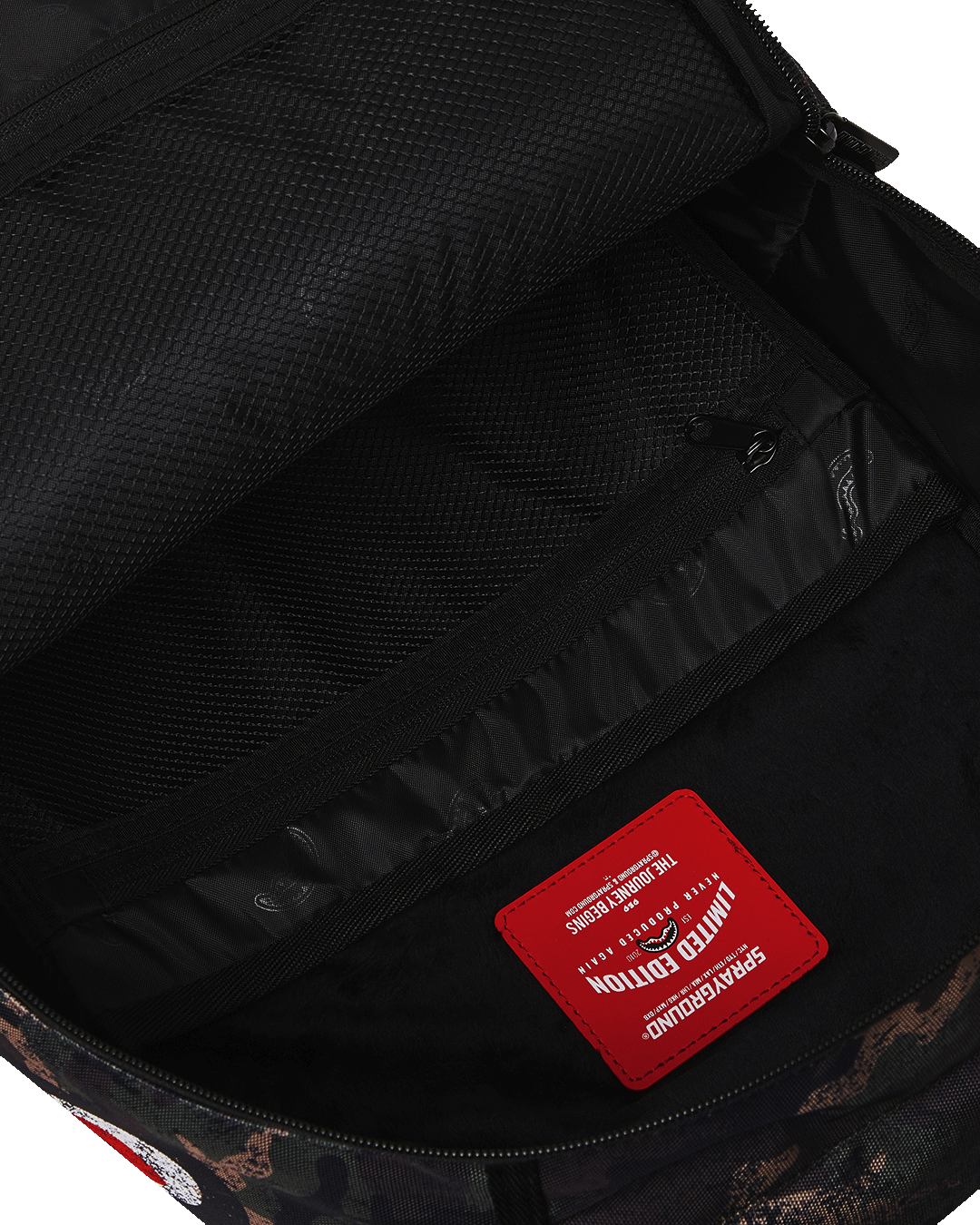 Interior shot highlighting laptop sleeve and mesh organizer pocket