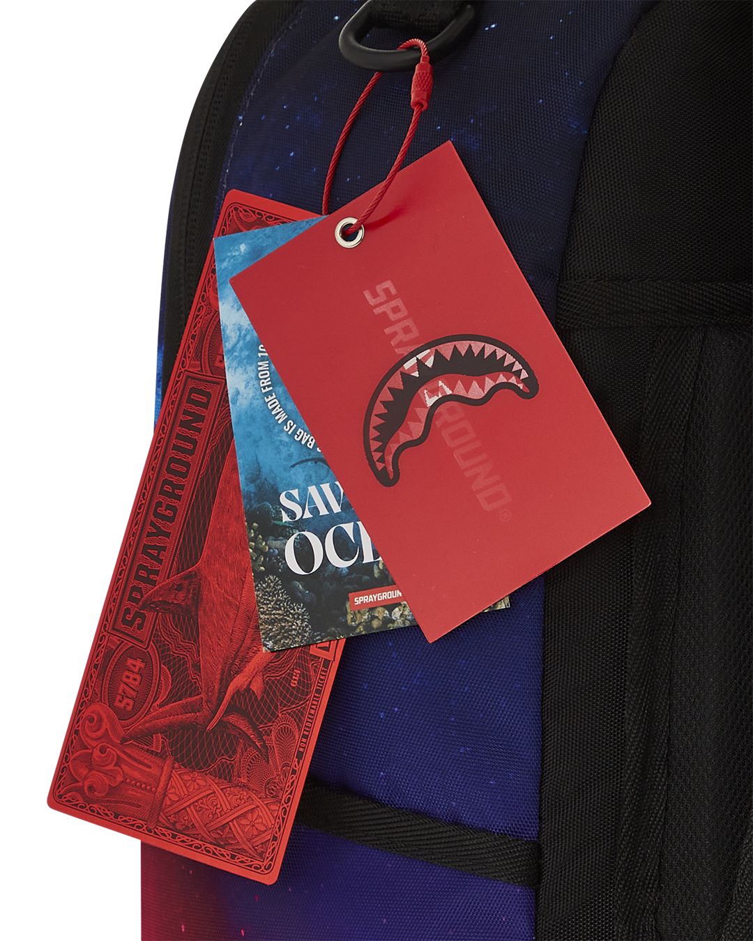 MOONDIVER Infinite Suns backpack front view, showcasing the front zipper pocket and Sprayground Authentic badge
