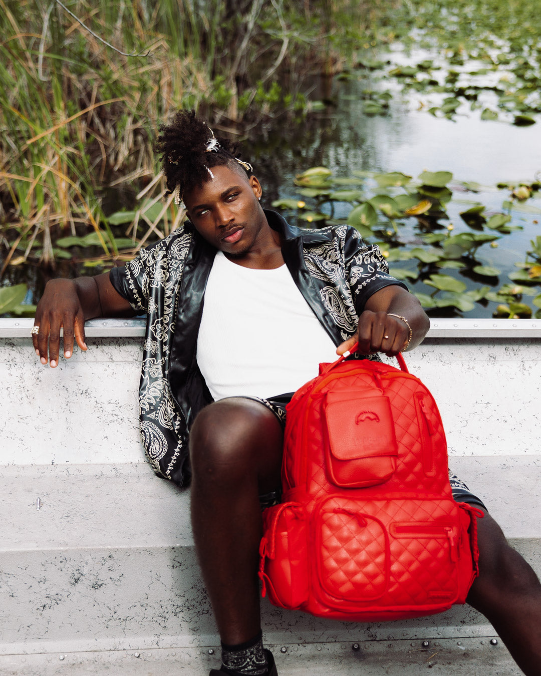 Front view of stylish female backpack with gold zippers and ergonomic design