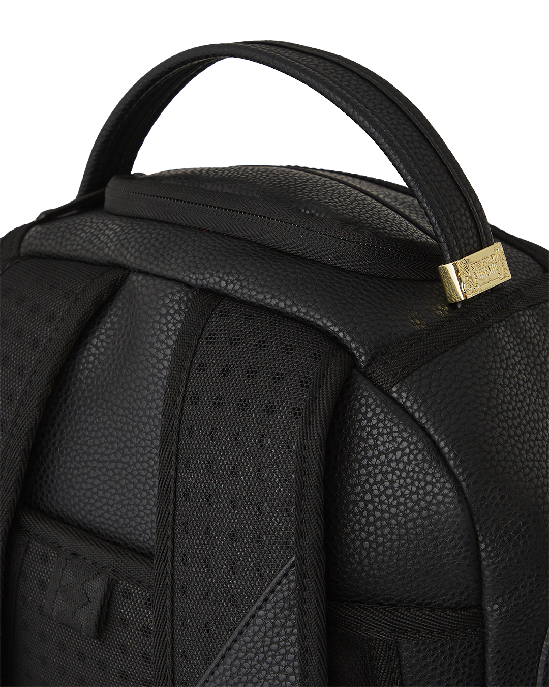 Interior of leather laptop backpack showing velour-lined laptop compartment