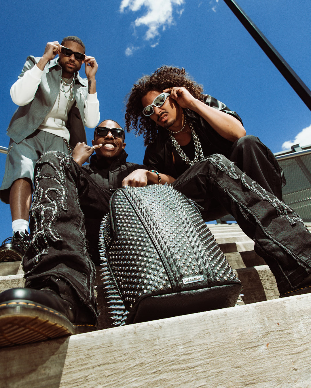 Side angle of the limited edition Sprayground backpack showcasing pockets.