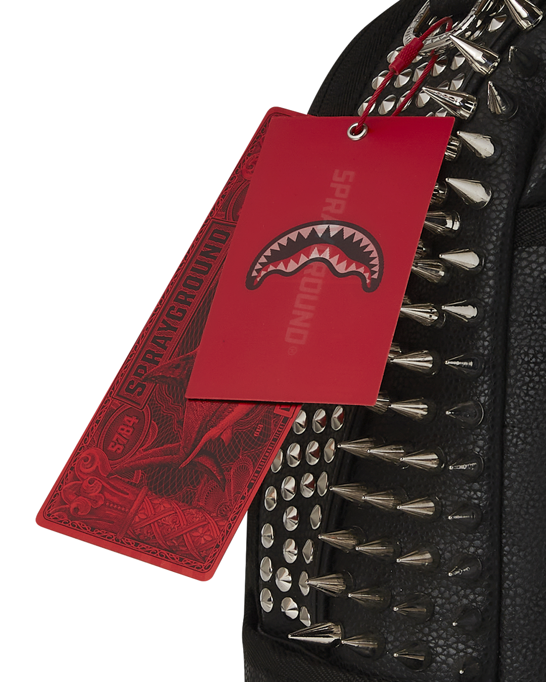 Front view of the pink Sprayground faux leather backpack with spikes.