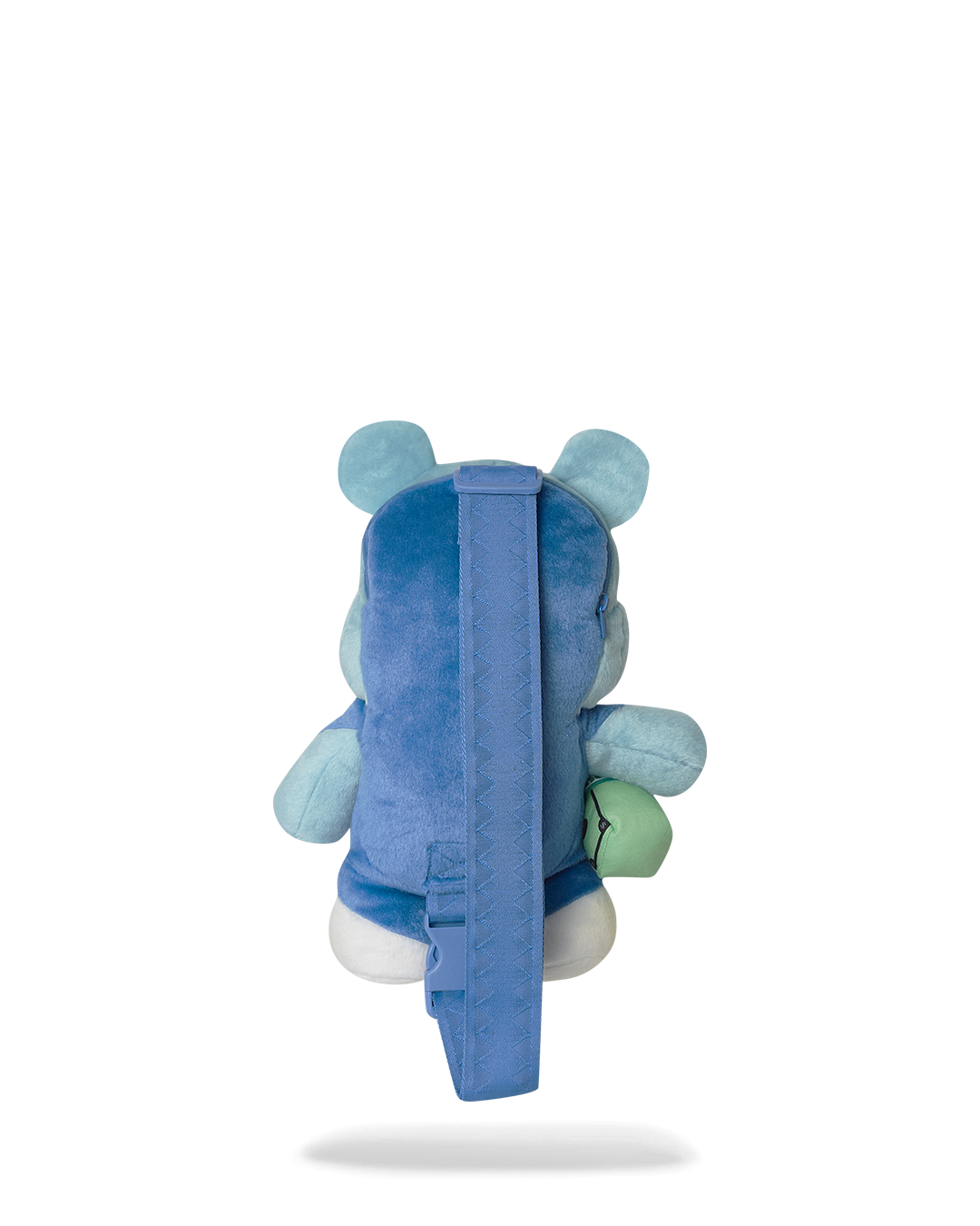 Side profile of fashion backpack-style crossbody bag worn over shoulder