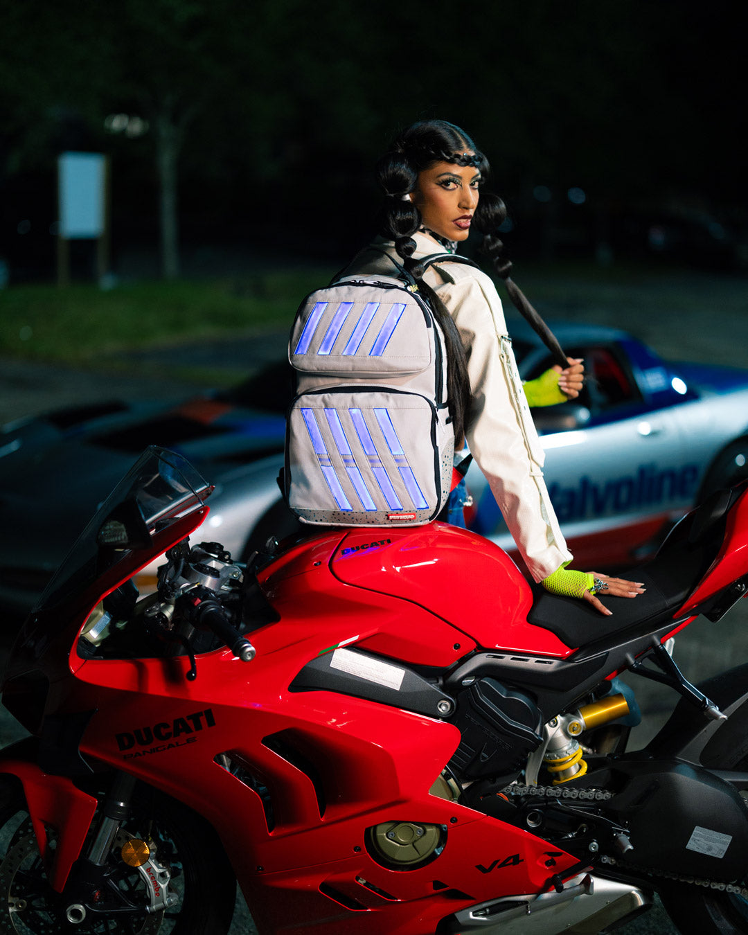 Backpack being worn with LED lights illuminating the design