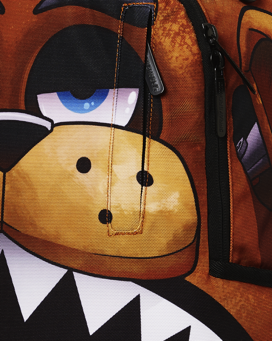 Sprayground Freddy Shark Backpack being used by a gamer at a desk