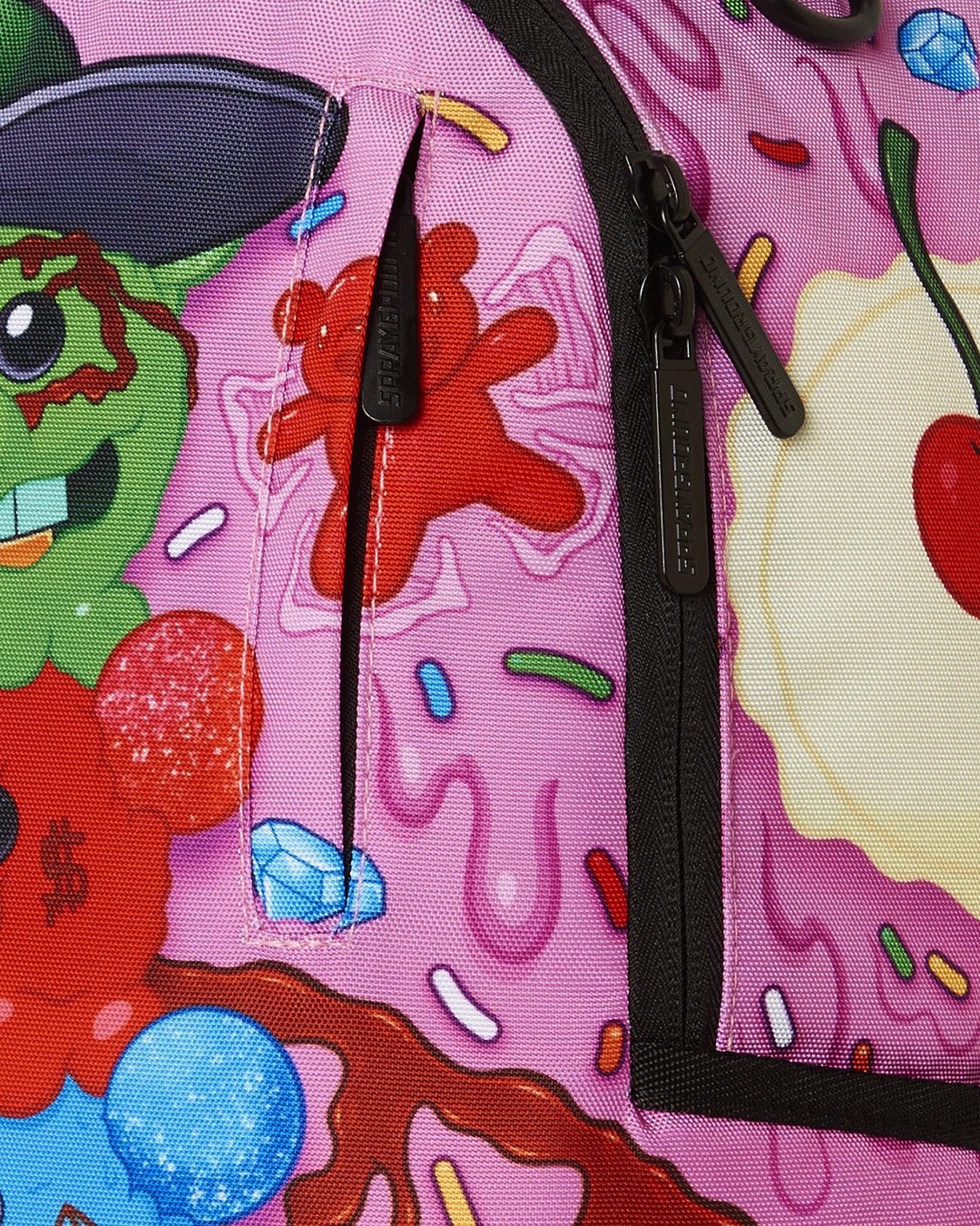Close-up of the sprayground backpack with gold zippers and metal hardware