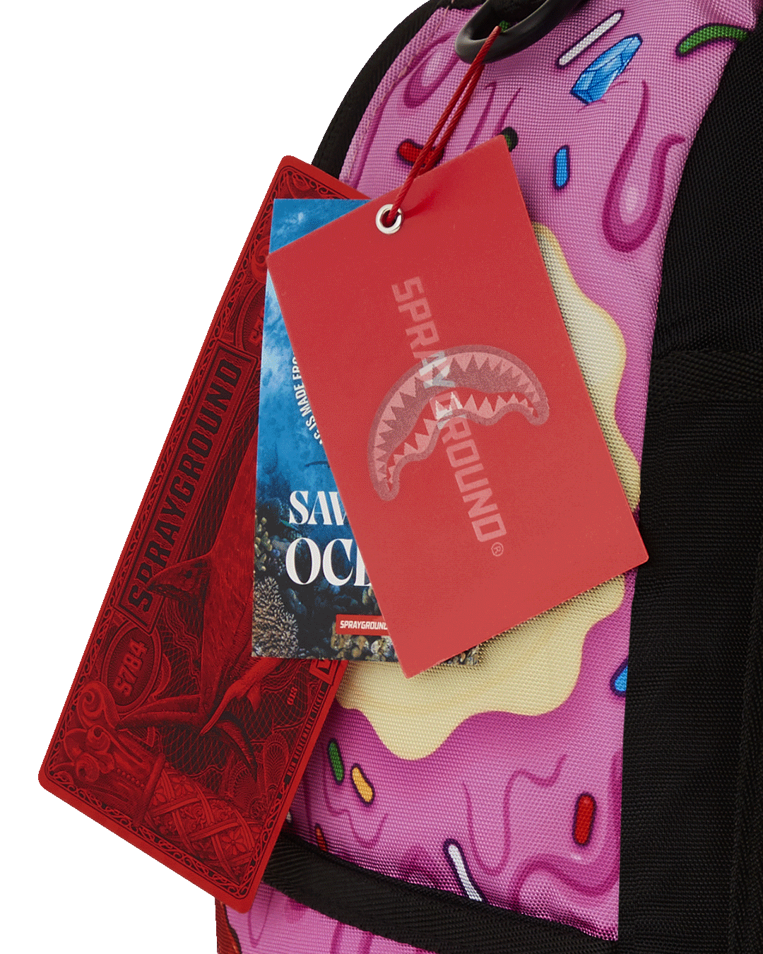 Close-up of the sprayground backpack with gold zippers and metal hardware