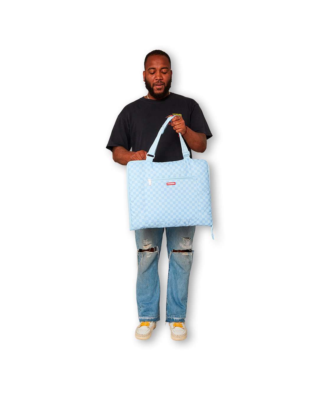 Coastal Cruiser convertible tote beach mat in its bag form, standing upright on the beach.