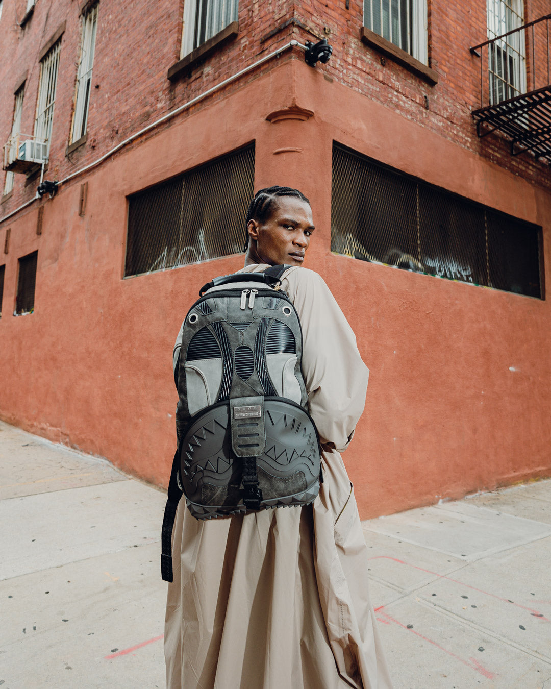 Backpack side view showing adjustable straps and ergonomic mesh padding
