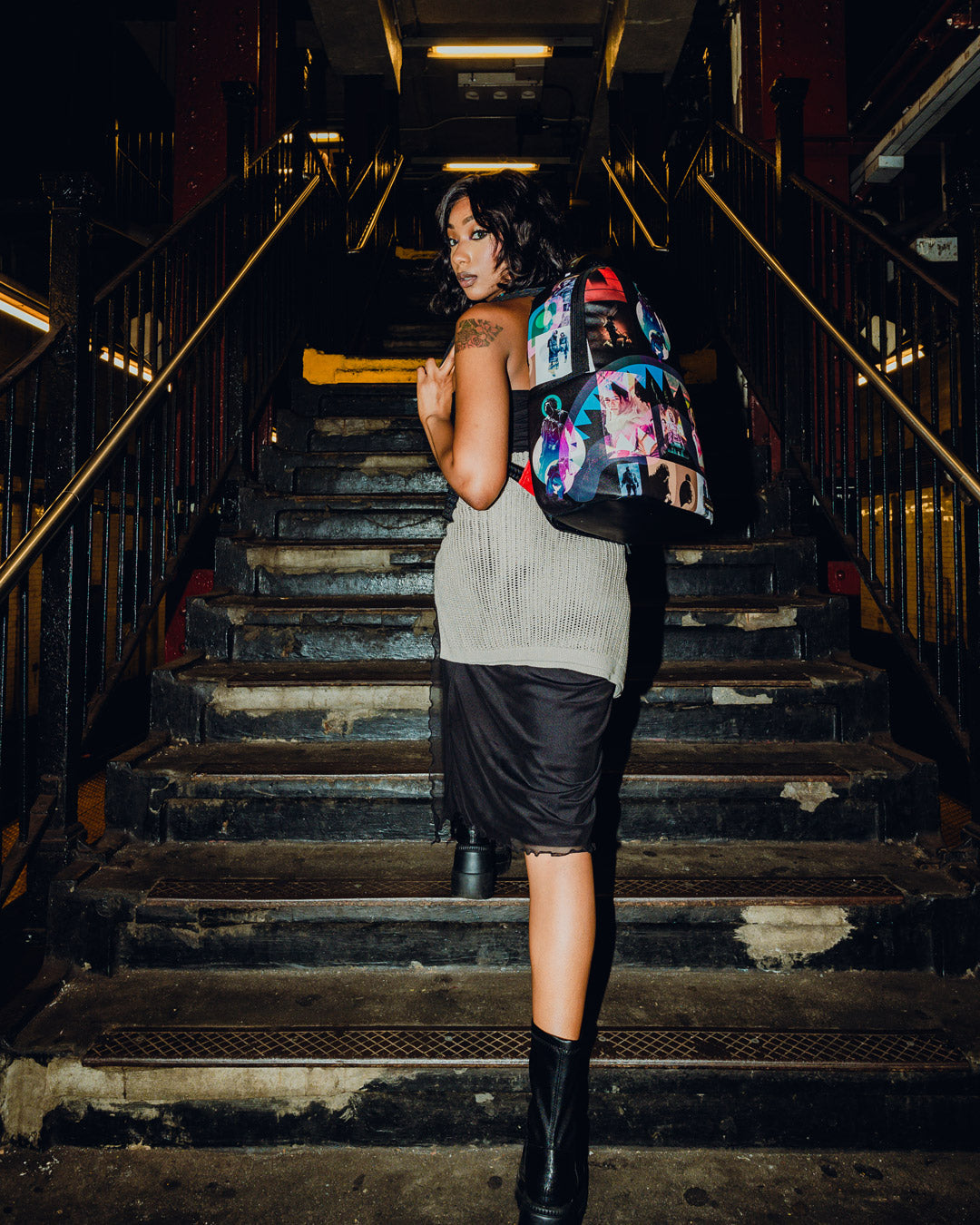Front view of the Dune collab faux leather backpack showing its sleek exterior and gold zippers