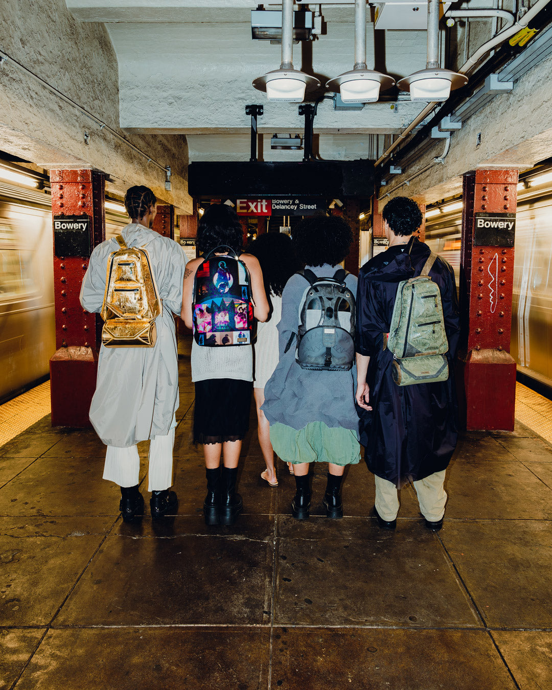 Front view of the Dune collab faux leather backpack showing its sleek exterior and gold zippers