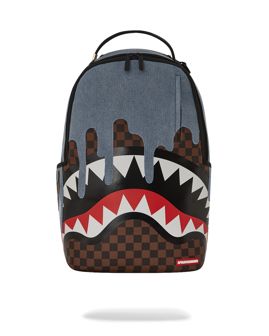 Close-up of faux leather backpack with gold zippers and shark artwork
