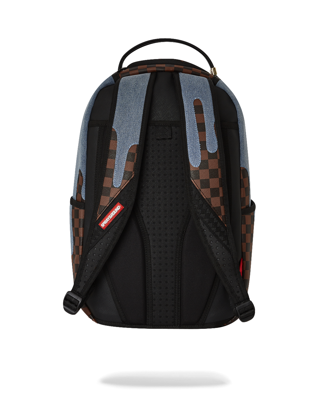 Close-up of faux leather backpack with gold zippers and shark artwork