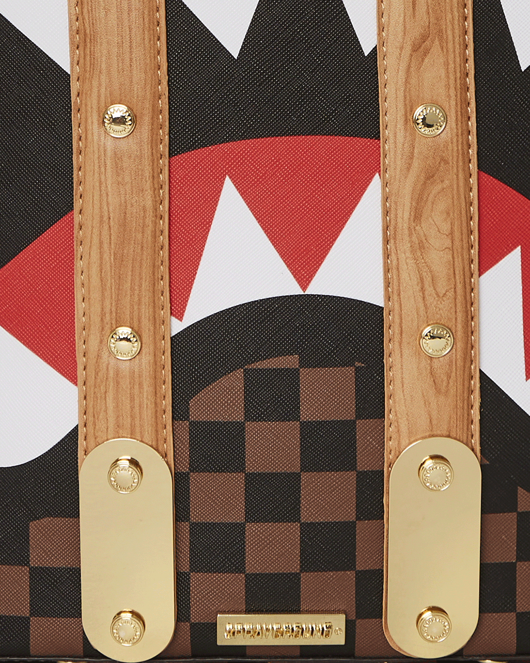 Close-up of gold zippers and organized pockets on the laptop bag