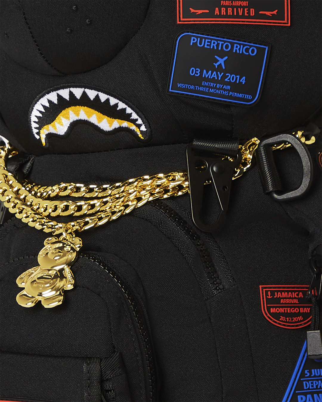 Sprayground Money Bear backpack shown front-on with zippered pockets