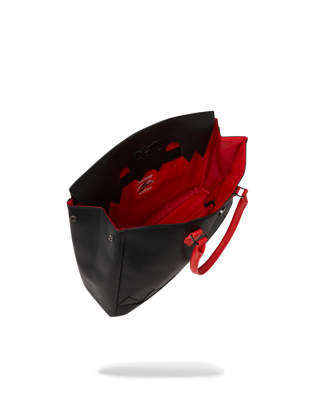 Side view of luxury handbag showing expandable snaps