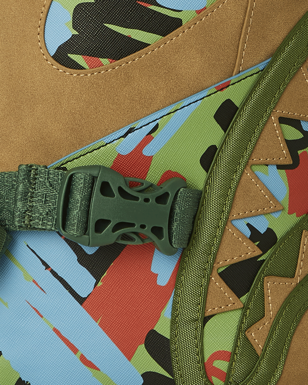 Side profile of the clear Sprayground backpack showing adjustable straps and pockets