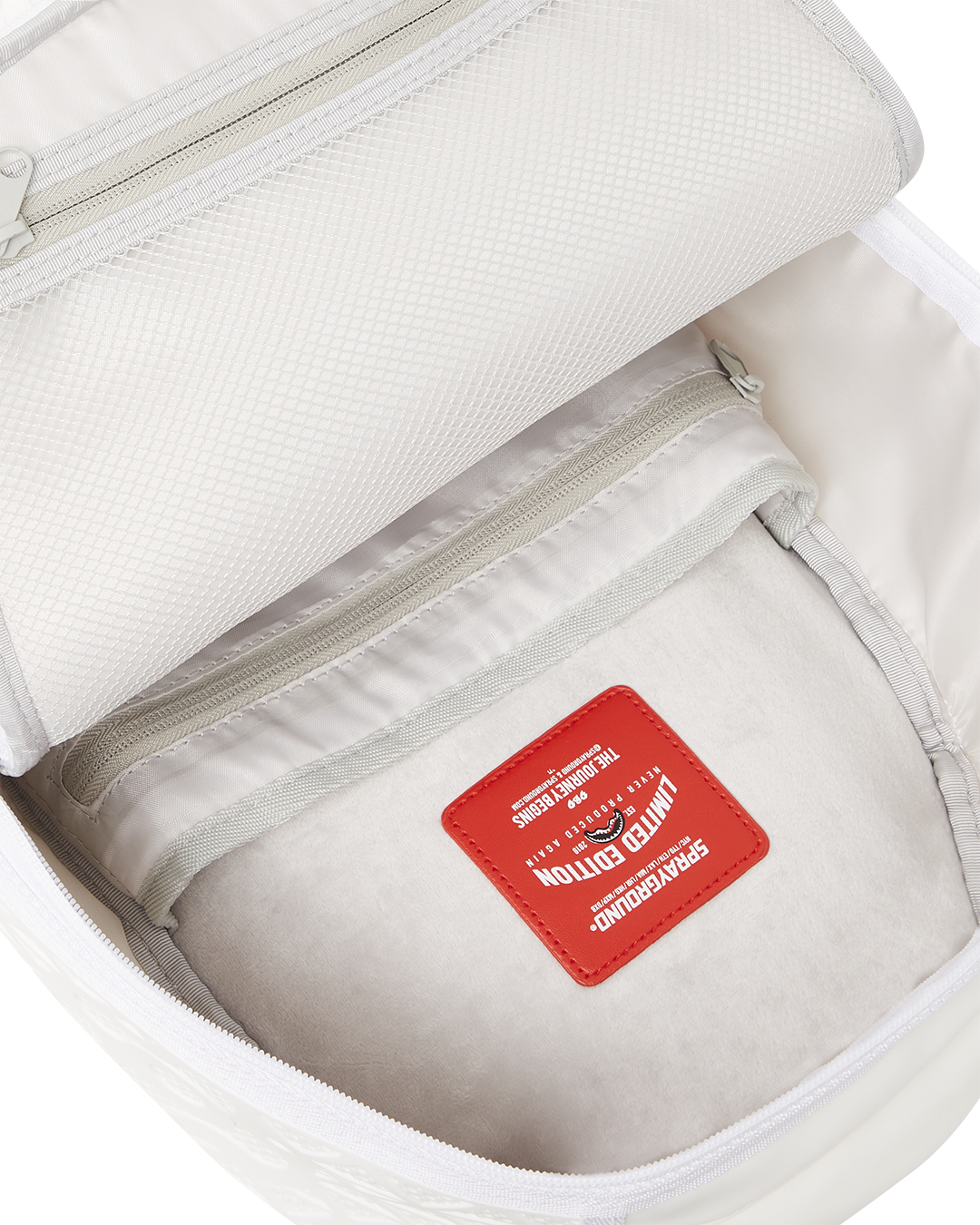 Interior shot displaying organized laptop compartment and mesh pockets