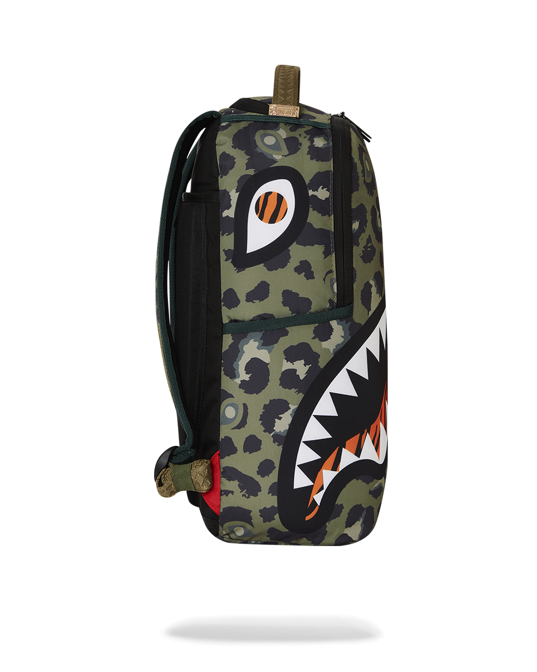 Back sleeve of backpack attached to a rolling suitcase in airport