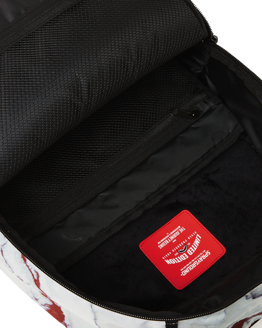 Backpack attached to luggage via slide-through sleeve