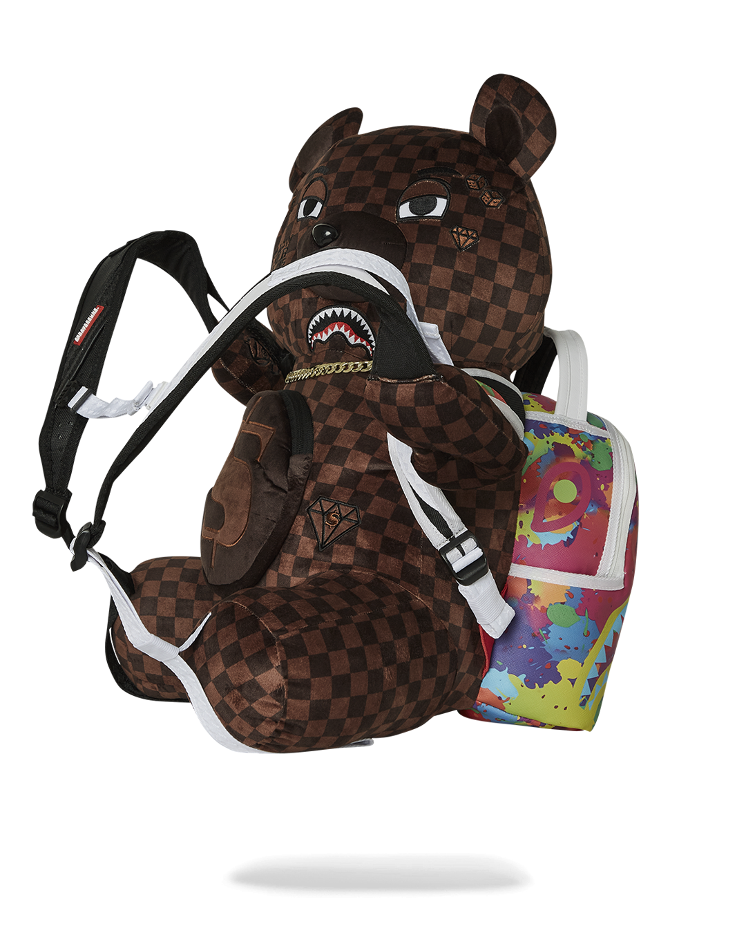 Cuddly teddy bear backpack worn by a child on a hiking trail