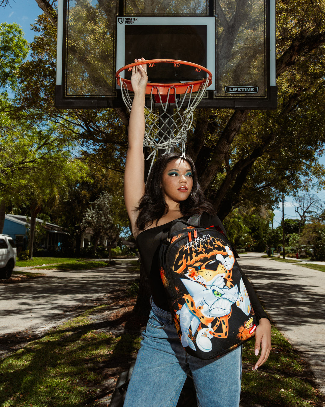 Interior view of Cheetos Shark Runner backpack showing laptop compartment and organizer pocket