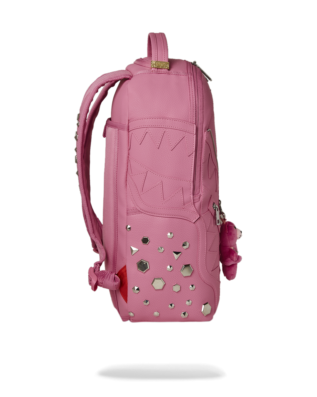 Backpack side panel with silver metal studs and decorative zipper detailing
