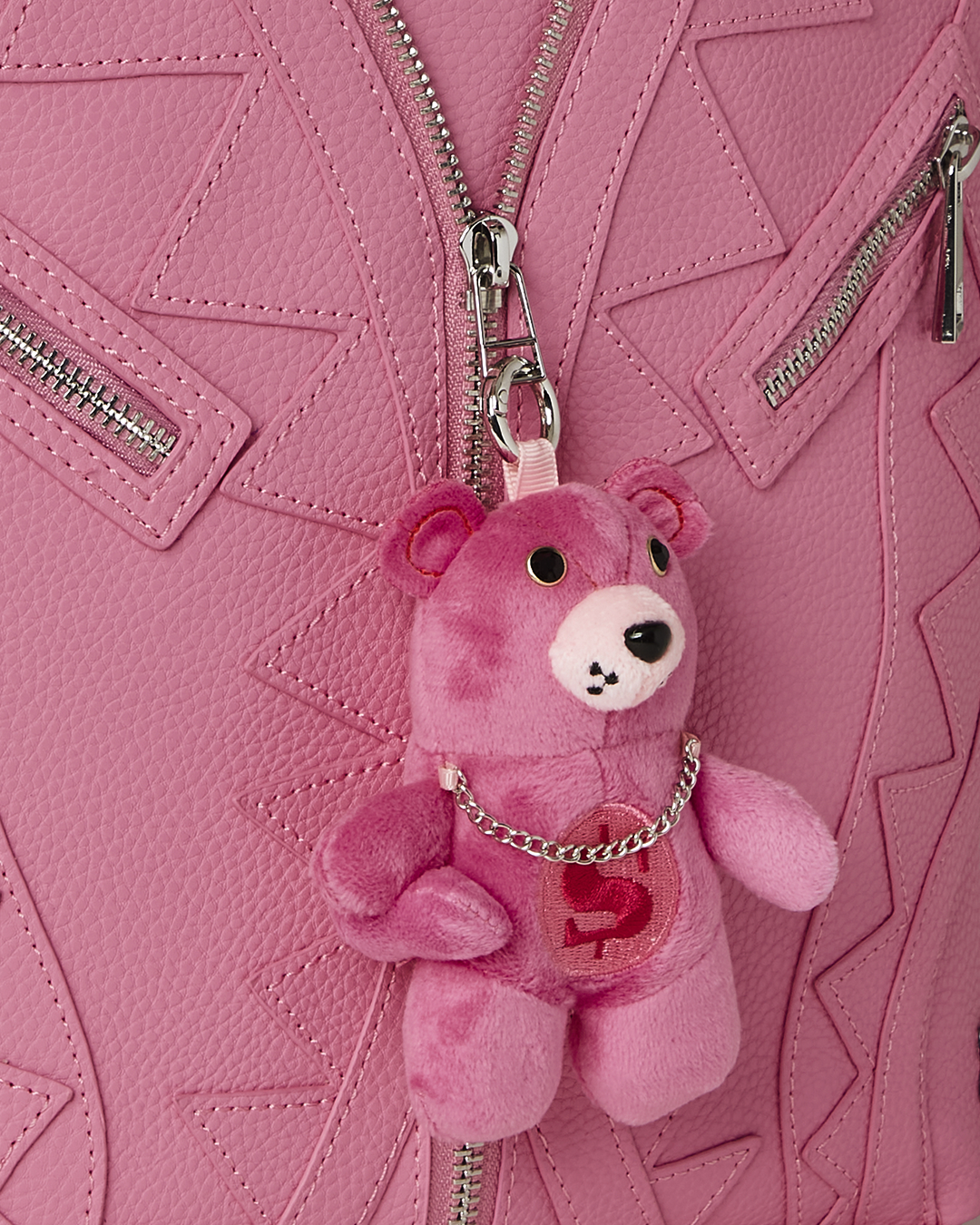 Faux leather backpack with plush bear accent, front view