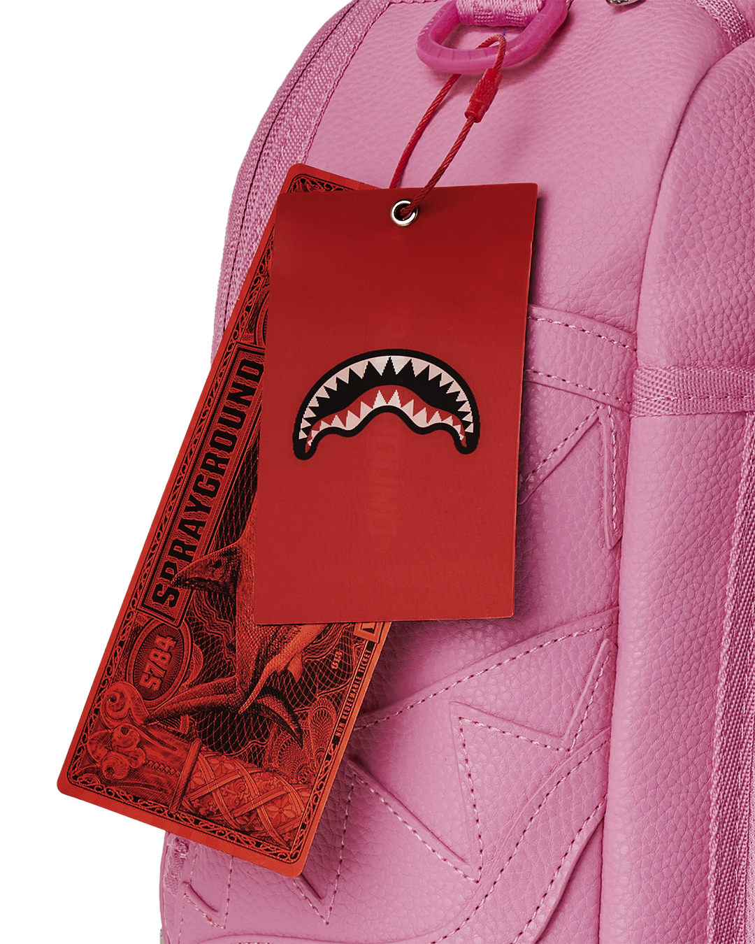 Backpack side panel with silver metal studs and decorative zipper detailing