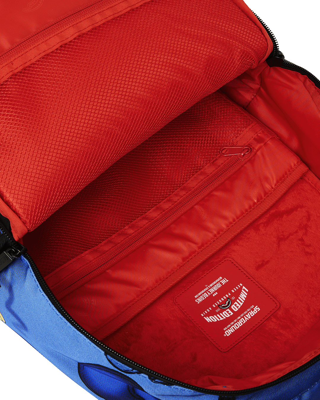 Side view of the RUGRATS backpack with pockets and gold zippers.