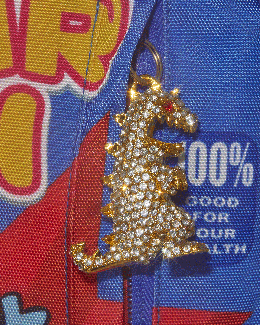 Side angle highlighting adjustable straps and gold zippers on Sprayground backpack