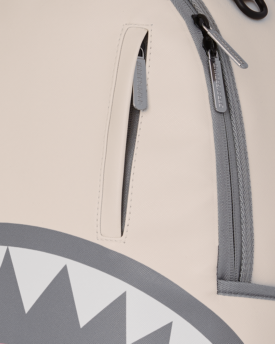 Back panel of faux leather backpack showing ergonomic mesh padding and adjustable straps