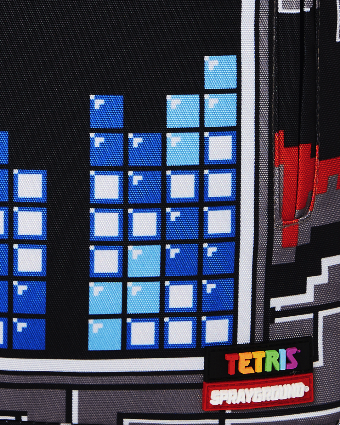 Front view of the pink sprayground backpack with Tetris shark design and gold zippers