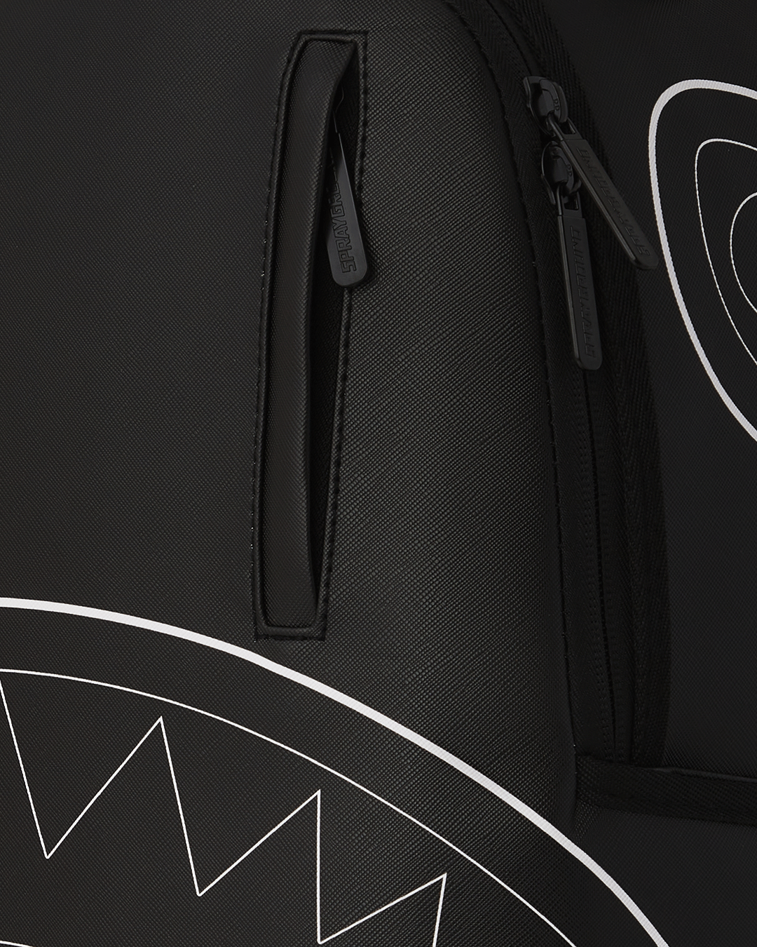 Backpack open to show the velour laptop compartment and interior organization