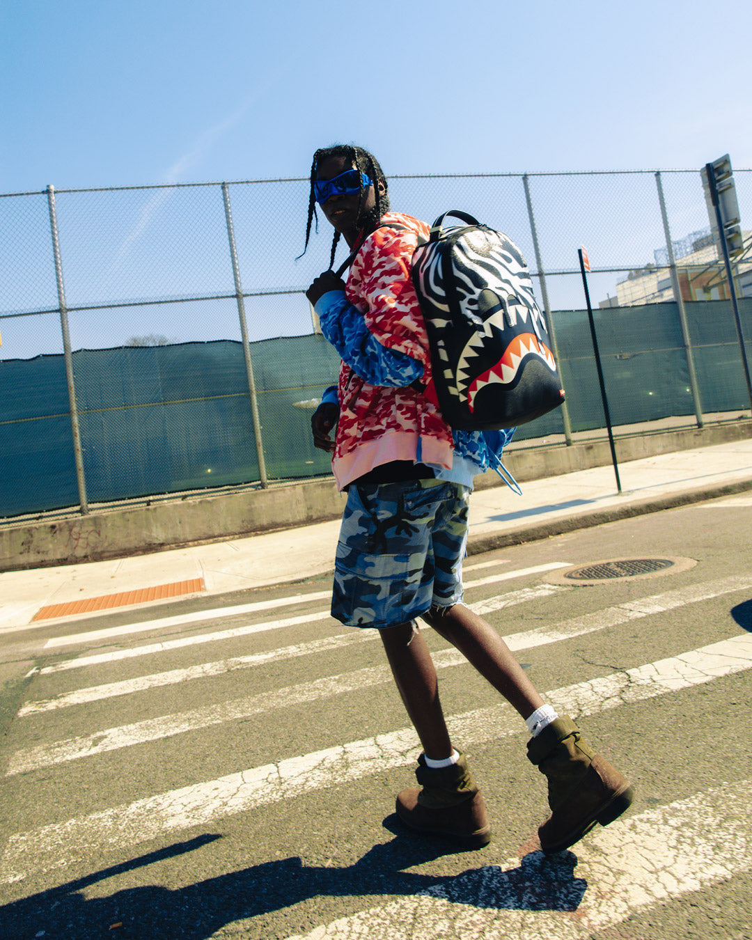 Faux leather backpack with front zipper pocket and side pockets, perfect for daily commutes.