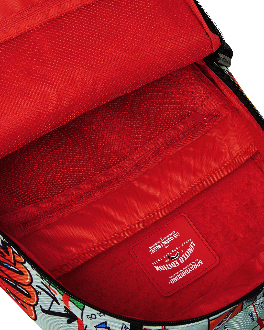 Sprayground Monopoly Backpack interior view featuring separate velour laptop compartment