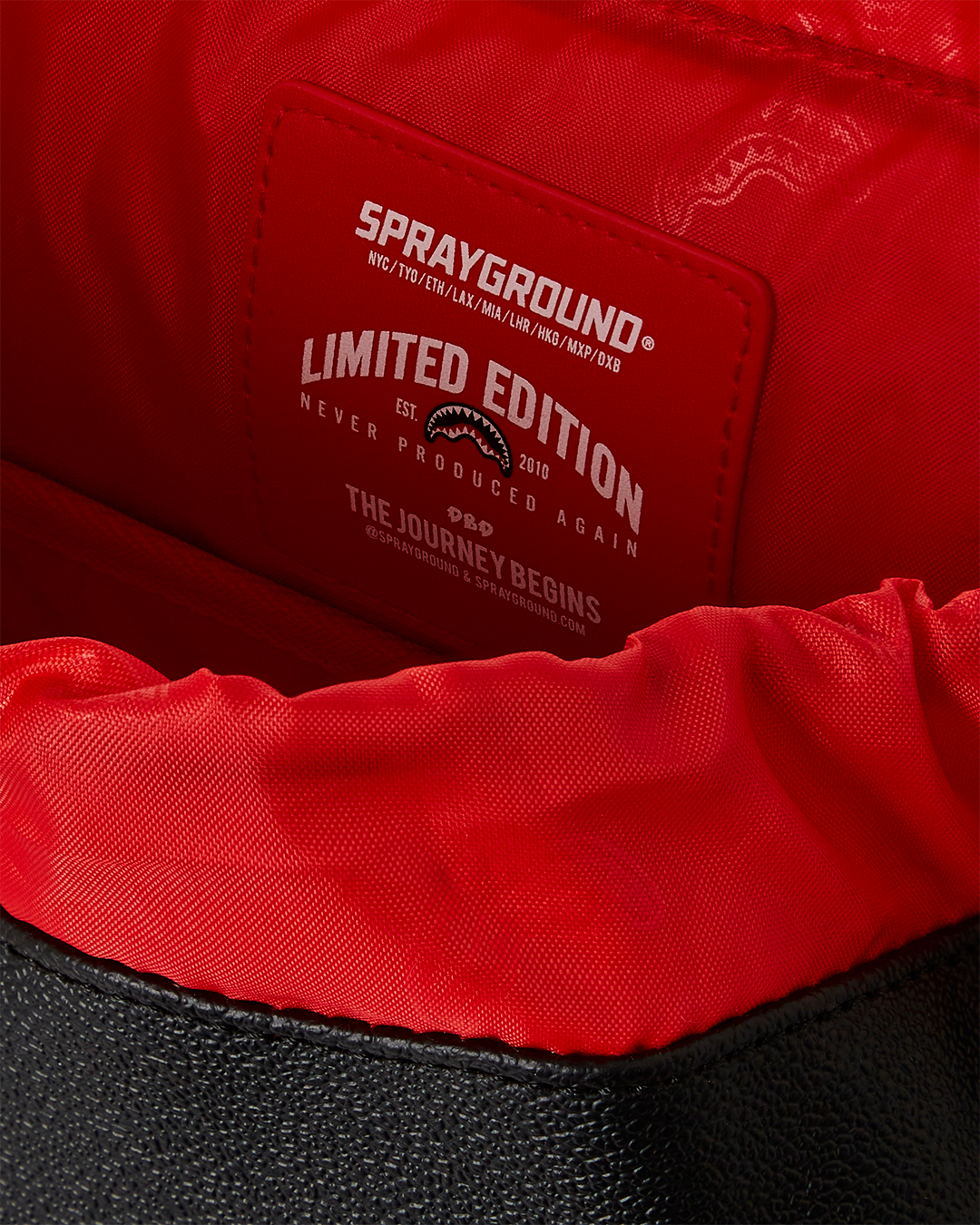 Front view of Monte Carlo Casino Backpack showing water-resistant faux leather exterior