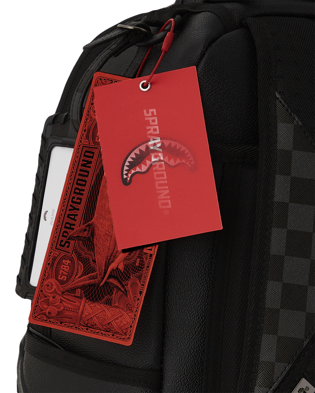 Close-up of embossed sharkmouth and gold zippers with metal hardware