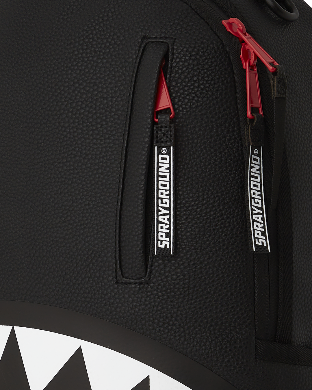 Silent Mirage backpack front view with zippered pockets and gold hardware