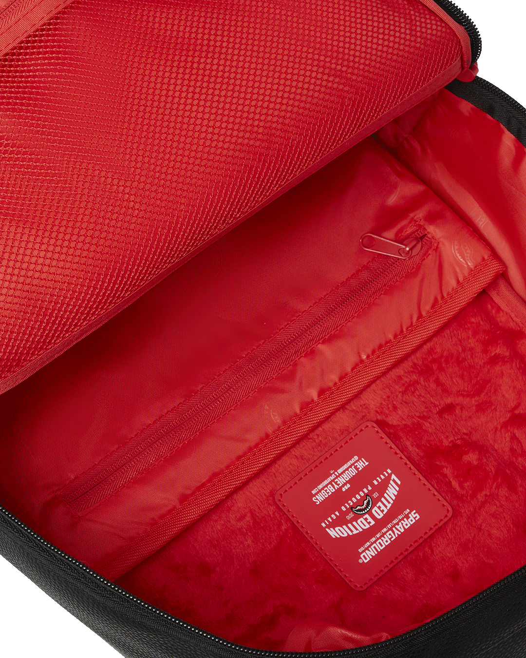 Open interior showcasing velour laptop compartment and organizer pockets