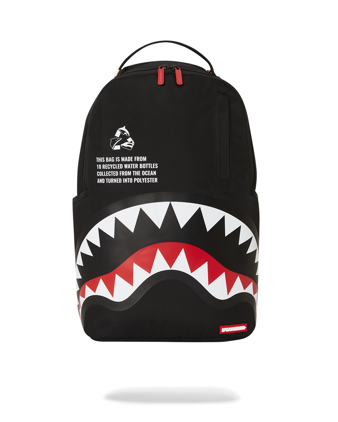 Sprayground faux leather backpack worn by a woman in a city setting