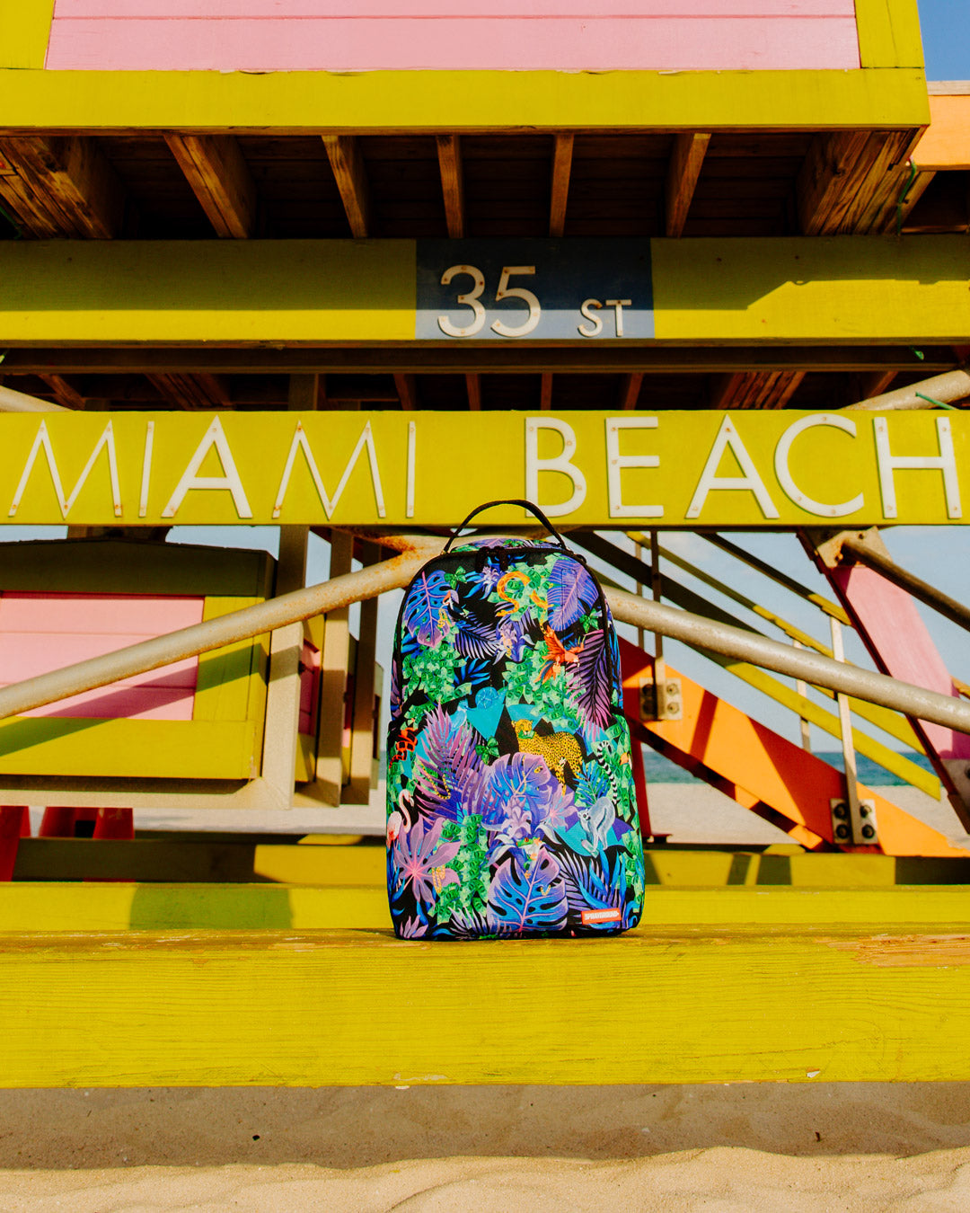Tropical Night Deluxe Laptop Backpack with ergonomic mesh back and adjustable straps.
